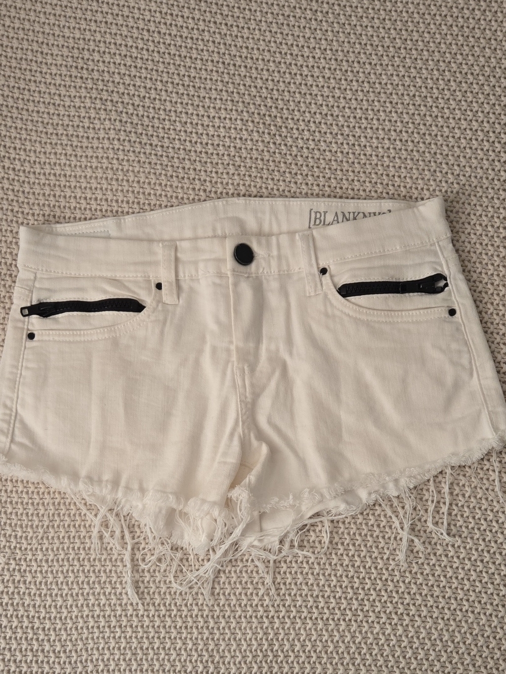 Blank NYC White Denim Frayed Cut-Off Shorts with Black Zip Accents